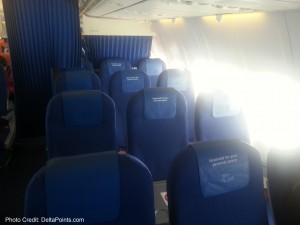 a row of blue seats on an airplane