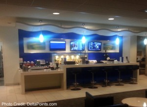 a bar with several tvs on the wall