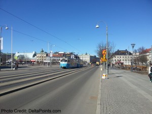 a blue trolley on the road