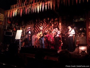 a group of people playing instruments on a stage