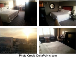 a hotel room with a bed and a view of the city