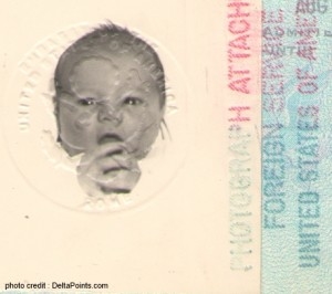 The image shows a passport page with a black and white photograph of a baby. The photo is embossed with a seal. There are also several stamps on the page, including one that reads "FOREIGN SERVICE" and "UNITED STATES OF AMERICA."