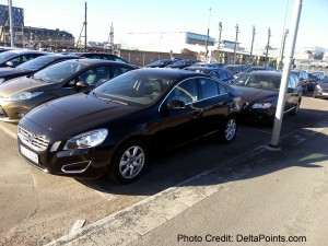 a black car parked in a parking lot