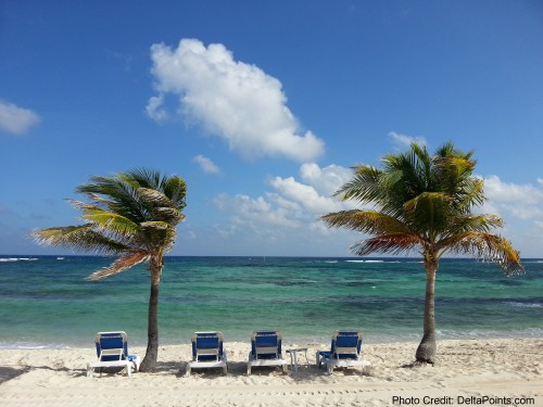 a row of chairs on a beach