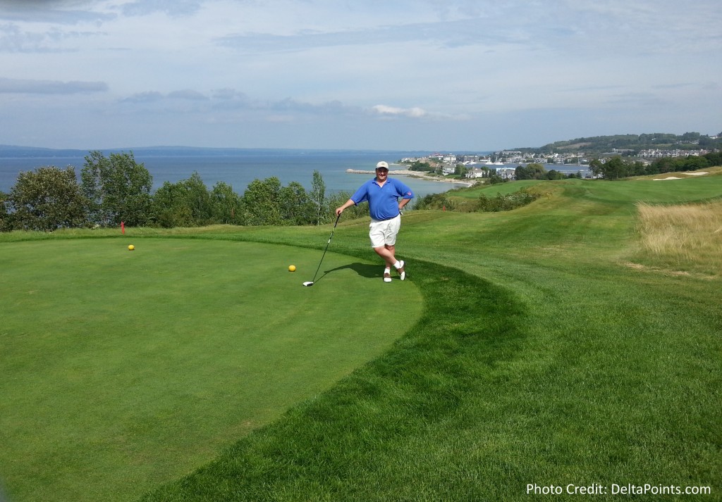 a man playing golf on a golf course