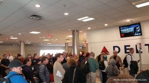 mass of people waiting to board atl to slc