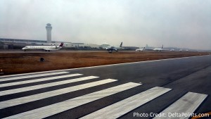 lots of jets waiting to take off DTW to IND delta points