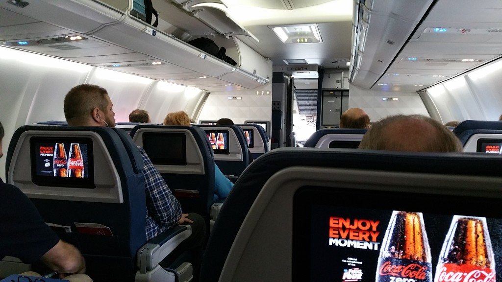 a group of people sitting in an airplane