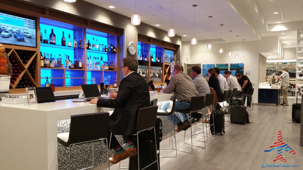 a group of people sitting at a bar