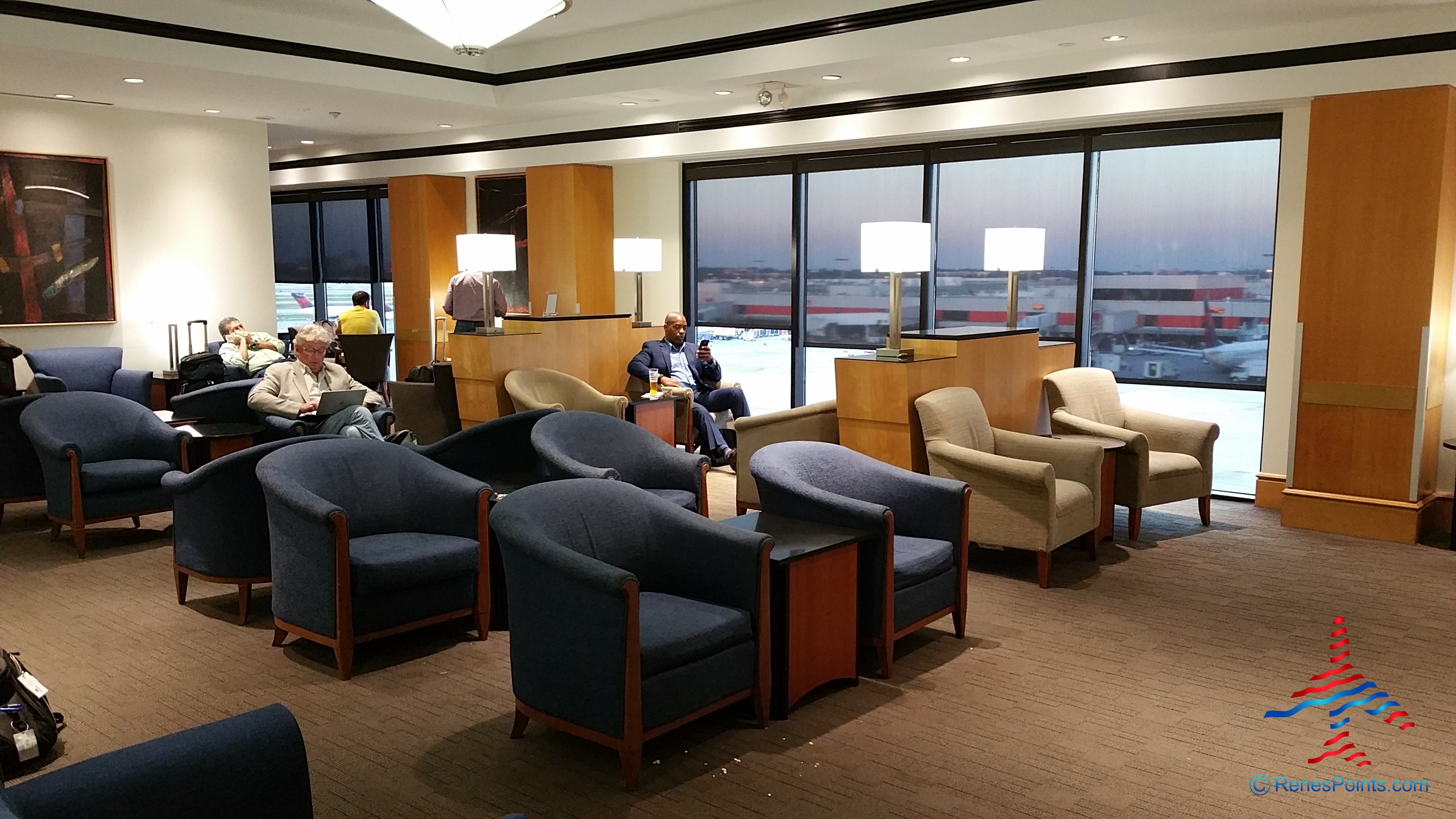 a group of people sitting in a lounge area