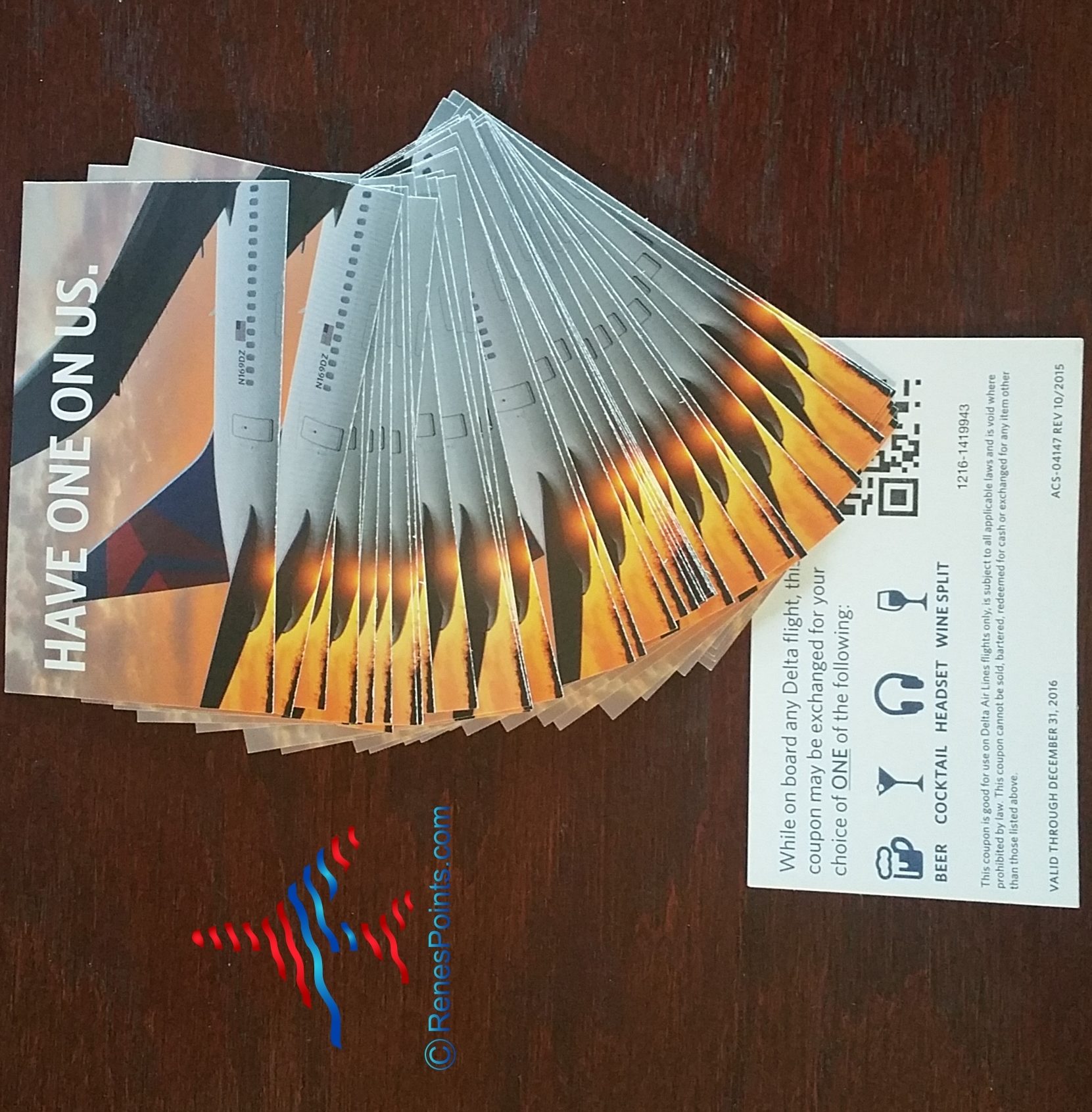Stack of Delta Air Lines Have One on Us (or HOOU) drink coupons.
