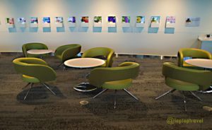 four-green-chairs-table-set-balcony-area-delta-seatac-skyclub-terminal-a-seattle-airport