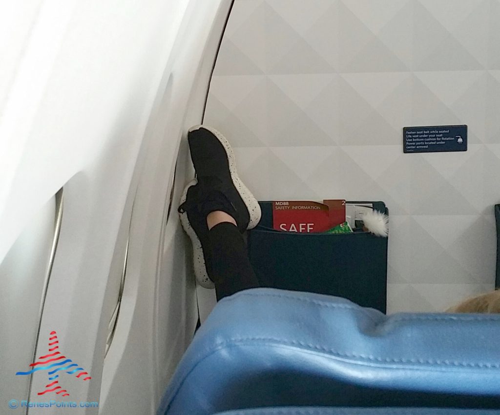 a person's foot on an airplane