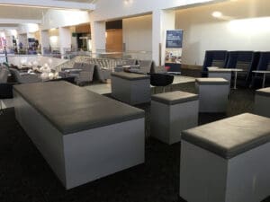 a room with many tables and chairs