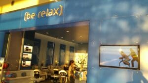 a blue building with a sign