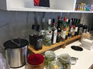 a shelf with bottles of alcohol