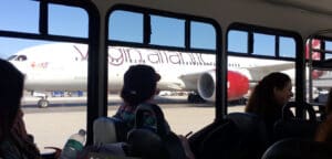 a person sitting in a bus looking out the window