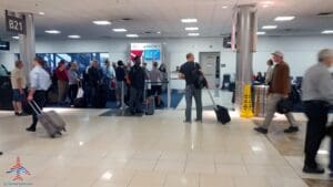 a man with luggage in a airport