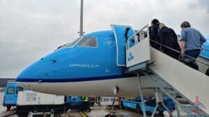 a blue and white airplane with people on it