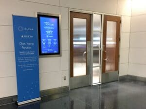 a room with glass doors and a sign