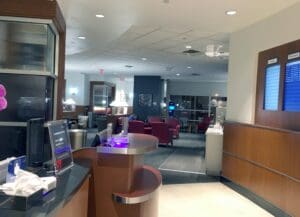 a lobby with a counter and chairs