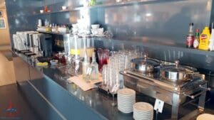 a kitchen counter with many dishes