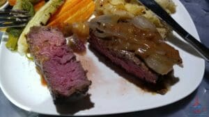 a plate of food with a slice cut in half