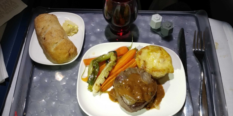 a plate of food on a tray