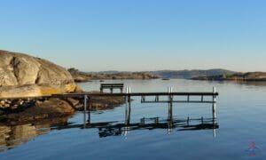 a bridge over water with a bench
