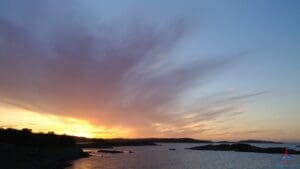 a sunset over a body of water