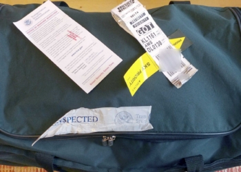 a bag with a piece of paper and a ticket
