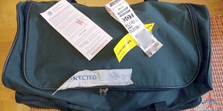 a bag with a piece of paper and a ticket