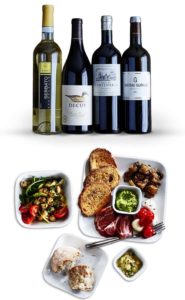 a group of bottles of wine and food