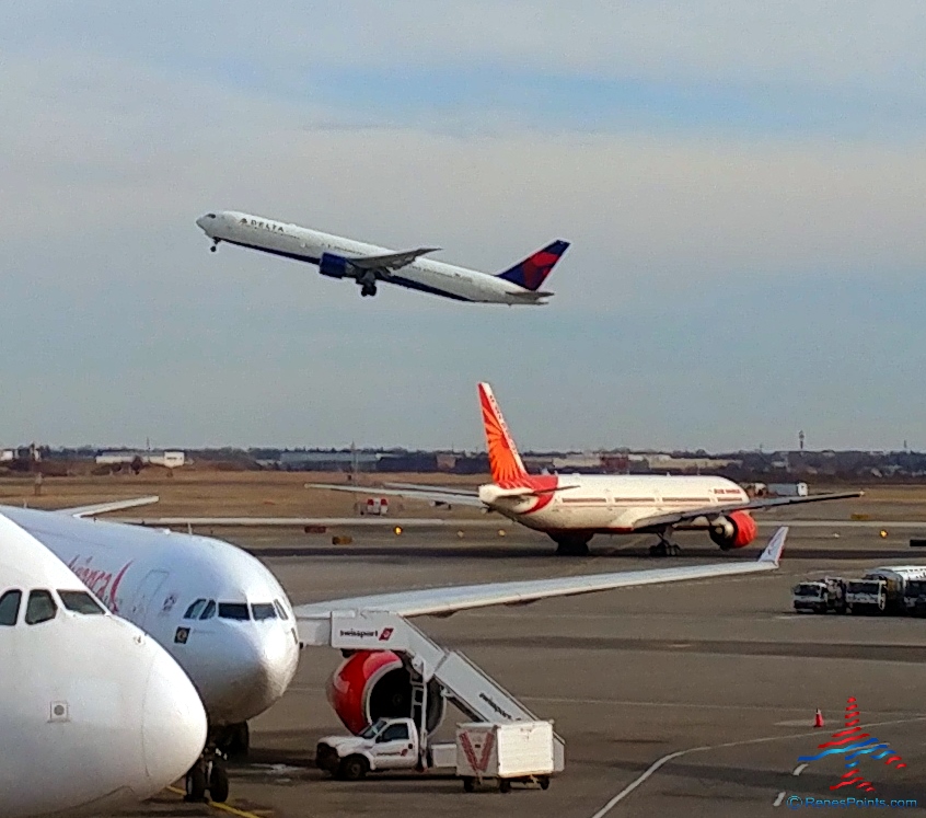 a plane flying over a runway