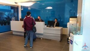 people standing in front of a desk