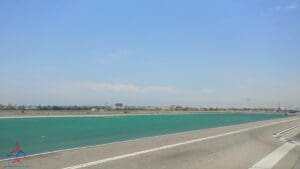 a road with a body of water