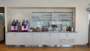 a white counter with white cabinets and white shelves