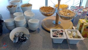 a table with bowls of cereal and bowls of food