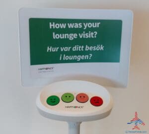 a sign with a green and red face on it