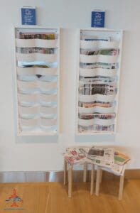 a chair and a magazine rack