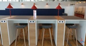 a table with chairs and lamps