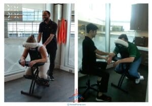 a man sitting on a chair with a woman in the back