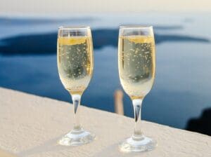 two glasses of champagne on a table