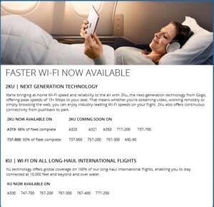 a woman lying in bed with headphones on