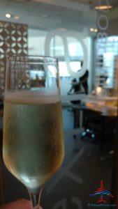 a glass of champagne on a table