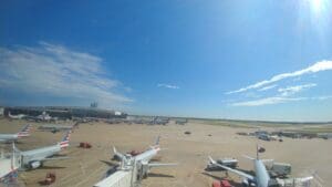 a group of airplanes on a runway