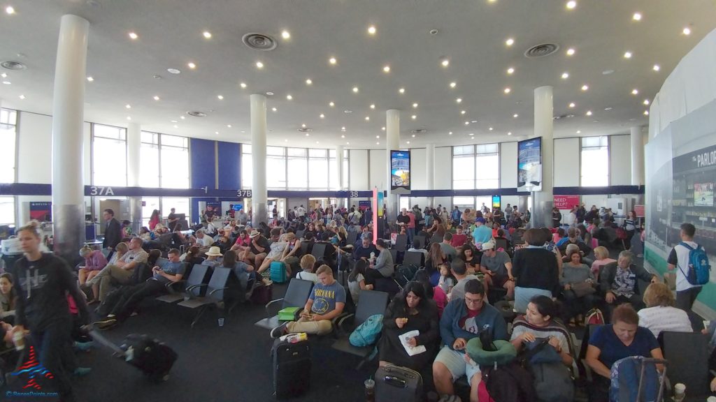 a large group of people sitting in a terminal
