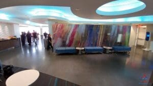 a group of people walking in a lobby