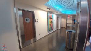 a hallway with art on the wall