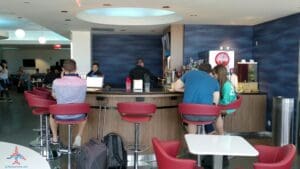 people sitting at a counter in a room